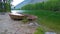 Boats on the shore of the taiga river in the foothills of the mountains