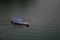 Boats and a small pedestrian bridge on the ghats of narmada river in the holy city of omkareshwar madhya pradesh India