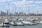 Boats in the St Kilda marina, with St Kilda foreshore and Melbourne skyline in background