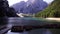 Boats stand on the shore of the Lago di Braies lake. Italy