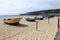 Boats standing on a sandy beach in Nazare