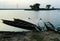 Boats submerged in a pond/lake evening scene