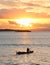 Boats on sunset sea