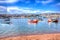 Boats on Teign river Teignmouth Devon with bright colourful blue sky HDR