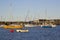 Boats on their moorings beside Cockle Island in the natural tidal harbour at Groomsport in Co Down,Northern Ireland with Belfast