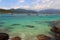 Boats in transparent water of beach Aventueiro of island Ilha Grande, Brazil