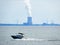Boats travel across Lake Ontario and Nine Mile Nuclear Plant