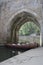 Boats under archway on River Wear, Durham City.