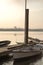 Boats wait in the morning mist along the Potomac river - Vertical Orientation