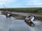 Boats at water's edge, Burnham Overy Staithe, North Norfolk coast, UK