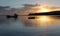 Boats on the water at sunrise