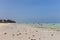 Boats on wide coastline on Zanzibar island. Sailboats on the beach. Tropical resort. Aerial seascape, Africa.