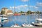 Boats, yachts and fishing vessels line the old harbor or Vieux Bassin in the charming Normandy village of Honfleur, France