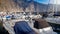 Boats and yachts moored in the sea harbour between in lagoon between high cliffs and mountains