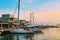 Boats and yachts in sea marina in old Limassol port at sunset, harbor in mediterranean coast, Limassol, Cyprus