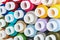 Bobbins Sewing threads multicolored background