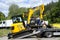 Bobcat for loading radioactive waste loaded on a truck crane trailer