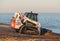 Bobcat T650 Track Loader moving shingle on Aldeburgh beach. UK