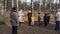 BOBRUISK, BELARUS 03.09.19: Young children fight with pillows on a log in the park in the spring. Small kids play with