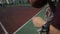 Bobruisk, Belarus - 12 August 2019: Close-up. Young basketball player bouncing ball on basketball court outdoors