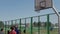 Bobruisk, Belarus - 12 August 2019: Slow motion. Close view. Handsome basketball player catching a ball, throwing it