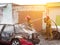 BOBRUISK, BELARUS - JULY 25, 2018: Two firemen extinguish a burning car, fire