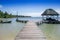 BOCAS DEL TORO, PANAMA - APRIL 20, 2018: Outdoor view of wooden pier with a hut located in Star fish beach on Bocas del