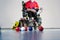 Boccia. A disabled sportsman sitting in a wheelchair in front of balls. Little balls for playing boccia.