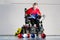 Boccia. A disabled sportsman sitting in a wheelchair holding little balls for playing boccia.