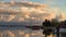 the Bodden near Zingst on the Baltic Sea in the evening hours. are reflected in the calm water