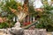 Bodhisattva with snakes statue under Ficus Religiosa tree on Ko Samui Island, Thailand