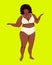 Bodie is a positive plump African American. A large-sized girl in full-length underwear. Plus size model posing.