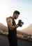 Bodies of steel are built with discipline. a sporty young man exercising with weights outdoors.