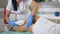 Body care, beautician Doctor performing laser hair removal on female patient Feet in clinic close-up, Apparatus for