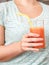 Body Care. Chubby girl standing in kitchen drinking detox juice close-up