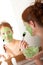 Body care - Young woman apply facial mask