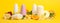 Body deodorants, ice and fruits on yellow background blank space for text