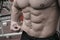 Body fat weight loss sport nutrition concept on strong young man with perfect body physique abdominal muscle and thin skin