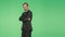 Body language. a man in a business suit on a green background. hromakey,