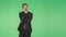 Body language. a man in a business suit on a green background. hromakey,