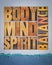 body, mind and spirit balance - a collage of text in vintage wood letterpress printing blocks, holistic approach