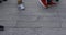 Body parts of walking people at the stone paved road in Asakusa