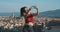 Body positive woman with a scar on her belly taking selfie on background of Florence. Travel, body positive, tourism