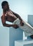 Body, relax and black man in studio for wellness, grooming or self care against a blue background. Topless, muscle and