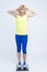 Body WeighÐµ Ideas. Surprised Mature Caucasian Sportswoman in Jogging Blue and Yellow Outfit While Checking Weight With