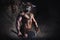 The bodyart man angry minotaur with axe in cave