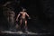 The bodyart man angry minotaur with axe in cave