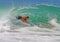 Bodyboarder riding a gnarly wave at Laguna Beach, CA