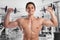Bodybuilder bodybuilding muscles body builder building gym strong muscular young man dumbbells shoulder training