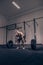 Bodybuilder deadlift, weights bar barbell, dark gym indoors